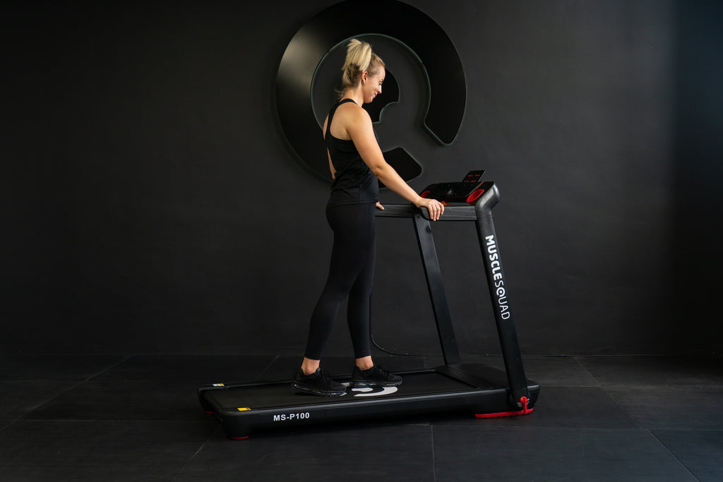Lady Walking on Muscle Squad P100 Treadmill